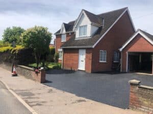 Tarmac driveway at a detached brick house